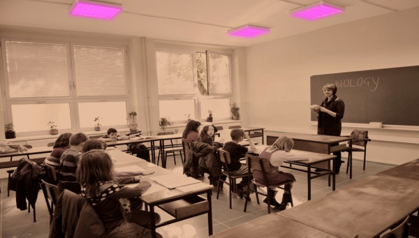 Image depicting a classroom with schoolchildren and a teacher under UVC light
